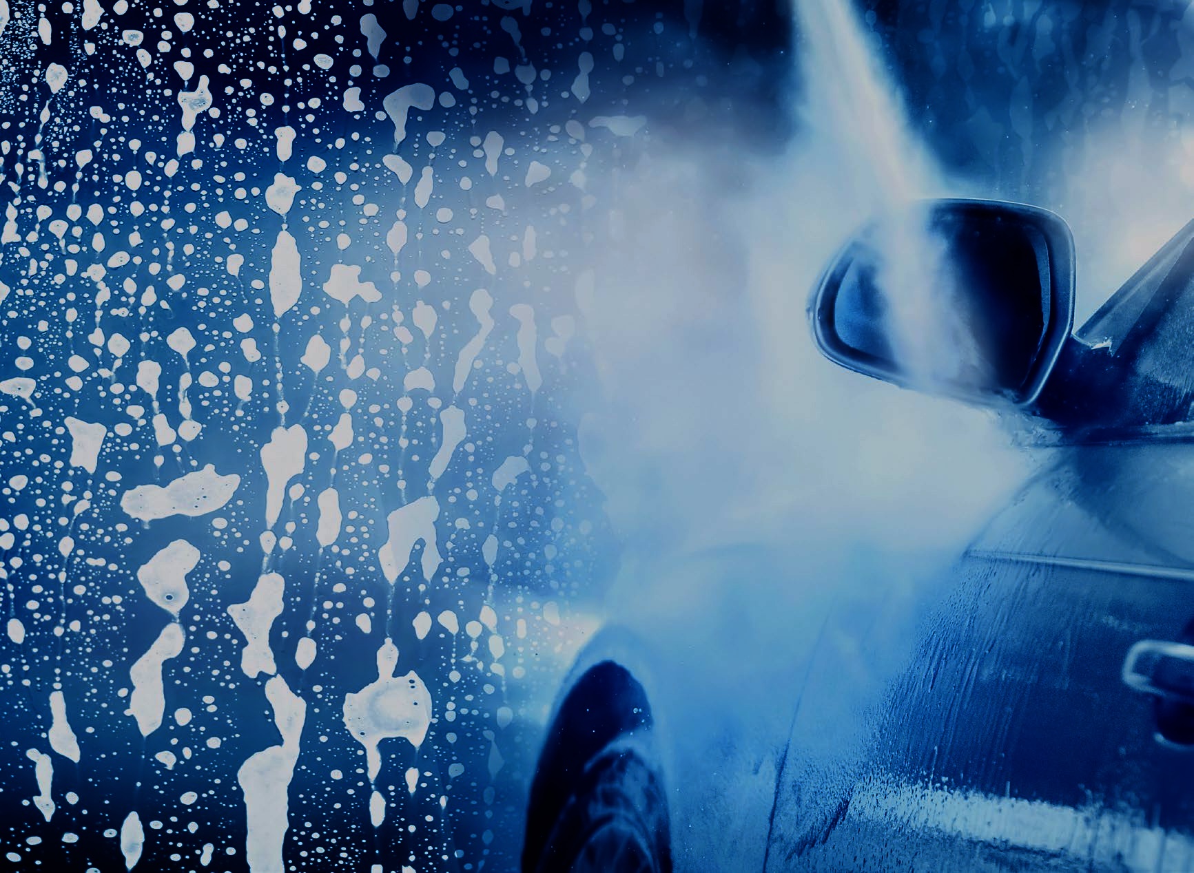 Atmospheric car wash interior with soap and electric blue lighting